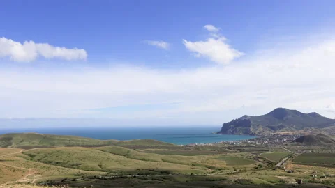 Movement of clouds over the volcano Karadag, the village of Koktebel. Stock Footage 155224328