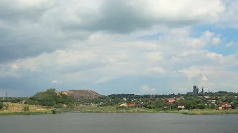 Movement of clouds on the river Kalmius. Donetsk, Full HD Video stock 65774433