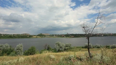 Movement of clouds on the river Kalmius. Donetsk, Full HD Stock Footage 65780683