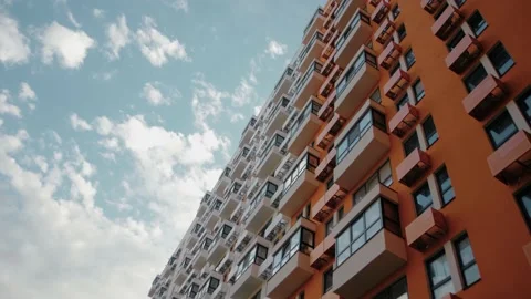 The movement of clouds in the sky against the backdrop of residential building. Stock Footage 223126610