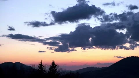 Movement of clouds in the sky, Hilly landscape at dusk Stock Footage 268841867