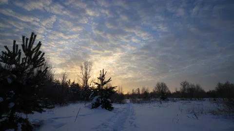 The movement of clouds on the sky. Winter sunrise timelapse. Stock Footage 169381161