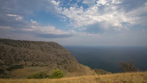 The movement of clouds in the spring in the Crimea peninsula Stock Footage 144054884