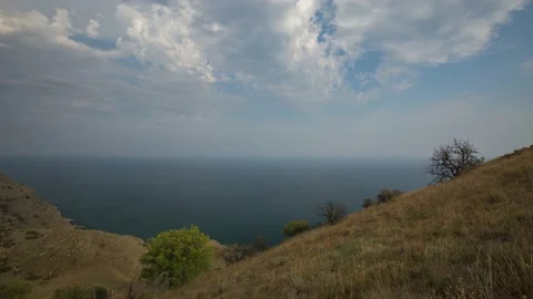 The movement of clouds in the spring in the Crimea peninsula Stock Footage 144054943