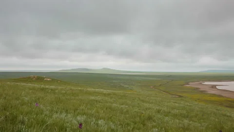 The movement of clouds in the spring in the steppe of the Crimea peninsula Stock Footage 87459220