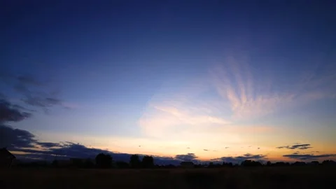 The movement of clouds at sunset. Timelapse. High quality footage Stock Footage 142510371