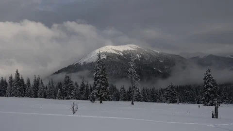 Movement of clouds in the winter mountains before a snow storm Stock Footage 74578036