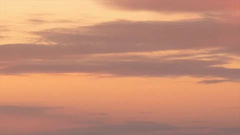 Movement of colored clouds at sunrise over a freezing lake Stock Footage 144840400