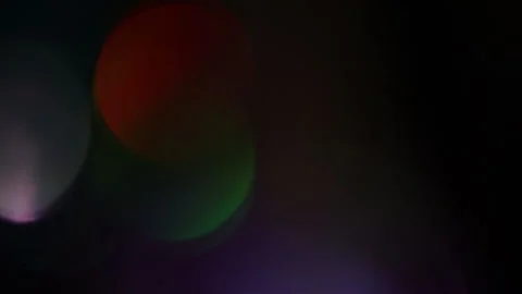 The movement of colored lights in a cluster in the dark Vidéo 309797941