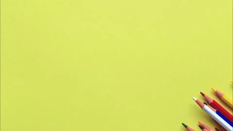 The movement of colored pencils on a yellow background. Video stock 159847104