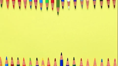 The movement of colored pencils on a yellow background. Video stock 159847115