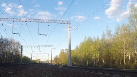 Movement of commuter trains in the spring timelapse Stock Footage 77283241