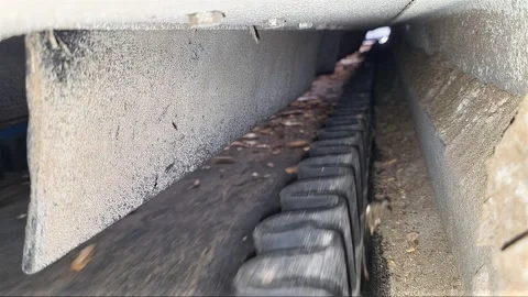 Movement of Conveyor Transporting Materials in a Busy Workshop Setting Stock Footage 345365090