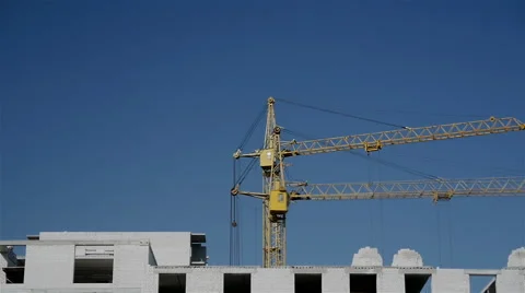 The movement of cranes on the construction site Stock Footage 65179330