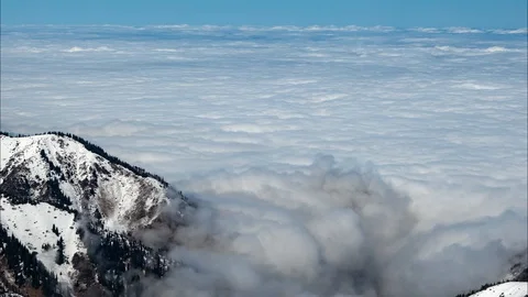The movement of a dense layer of clouds above the ground Stockbeeldmateriaal 106387336