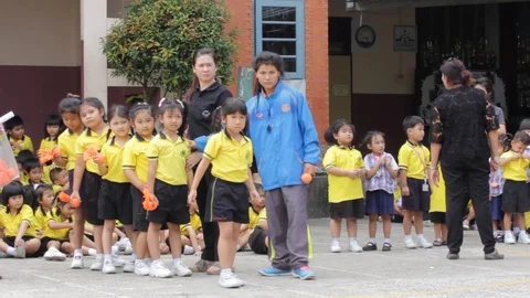 Movement education teaching kindergarten. Students are joyful Stock Footage 72169099