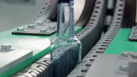 The movement of empty bottles along the conveyor belt. Stock Footage 166561588