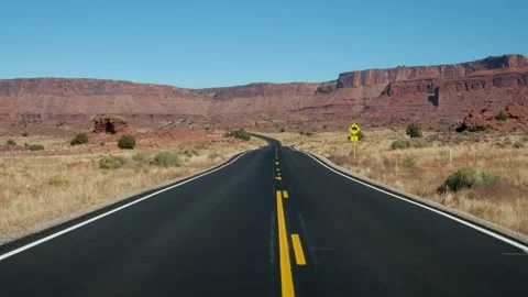 Movement On Empty Country Road Going Into Distance To Red Mountain Rocks Massive Stock Footage 237089880
