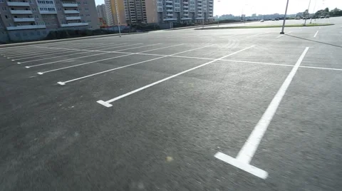 Movement in an empty parking lot shot on steadicam Stock Footage 41628611