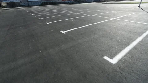 Movement in an empty parking lot shot on steadicam Stock Footage 41628615
