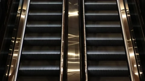 Movement of empty staircases of the escalators. Up and down moving escalator Stock Footage 219915412