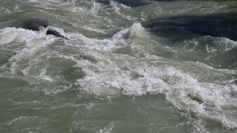 The movement of a fast mountain river close-up. The cold stream of river water Stock Footage 247573517