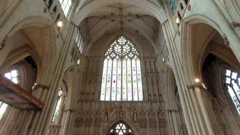 Movement from the floor of the cathedral to the large stained glass window Stock Footage 248625864