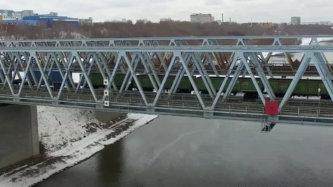Movement of freight train through the railway bridge Stock Footage 72907689