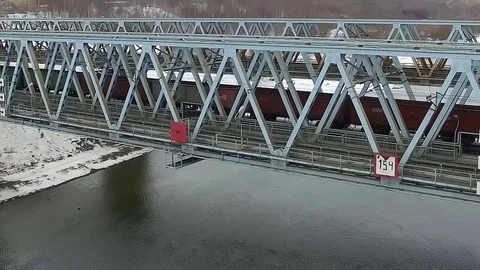 Movement of freight train through the railway bridge Stock Footage 72907728