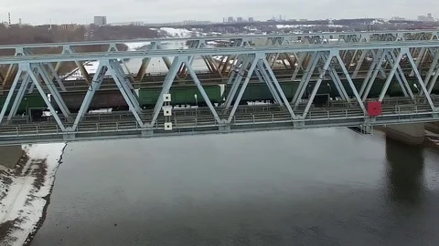 Movement of freight train through the railway bridge Stock Footage 72907753