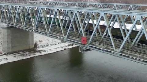 Movement of freight train through the railway bridge Stock Footage 72907821