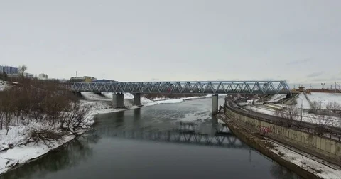 Movement of freight train through the railway bridge Stock Footage 72907998
