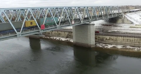 Movement of freight train through the railway bridge Stock Footage 72908199