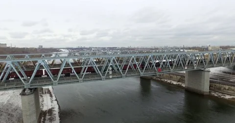 Movement of freight train through the railway bridge Stock Footage 72908433