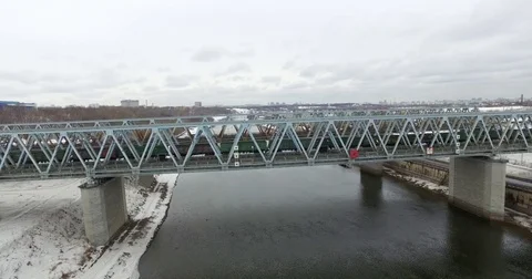 Movement of freight train through the railway bridge Stock Footage 72908701