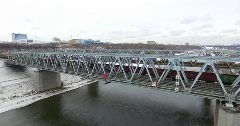 Movement of freight train through the railway bridge Stock Footage 72908863