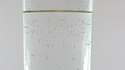 The movement of gas bubbles up glass inner edge of the glass Stock Footage 46792896