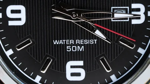 The movement of the hands of a wristwatch. Stockbeeldmateriaal 107702084