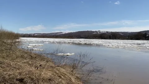 The movement of ice floes on the river during an ice drift in the spring. Stock Footage 152520981