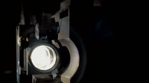 The movement of the mechanism, projector, rollers, cinema projection lens Stock Footage 68967770