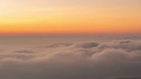 The movement of morning mist on the eastern side saw the orange horizon hitti Stock Footage 148270576