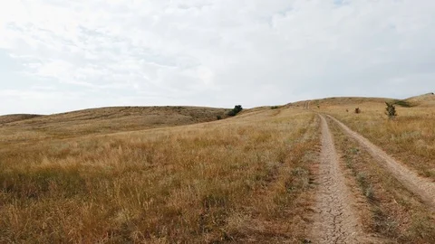 Movement up the mound in the steppe Stock Footage 113066065