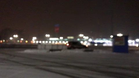 Movement in the night city in winter. defocus Blur. Video stock 103462883