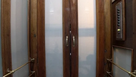 The movement of an old elevator going up in a house Stock Footage 126272414