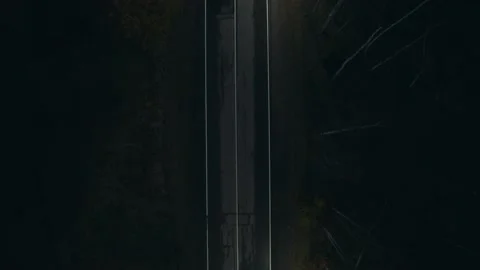 Movement over night highway Dear with lanterns Road marking dark shot from drone Stock Footage