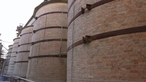 Movement past large destroyed cylindrical pipes made of brick and iron 스톡 동영상 117097007