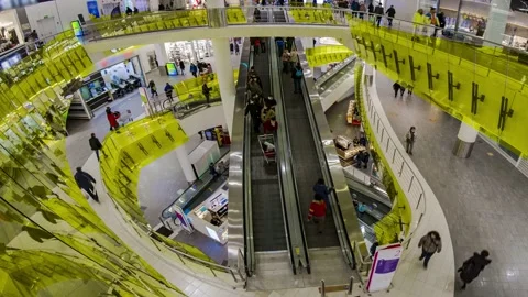 The movement of people on escalators  and galleries in the modern mall , time Stock Footage 169028443