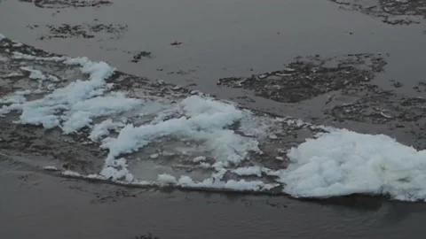 The movement of pieces of ice along the river at sunset, ice drift, Stock Footage 170876824