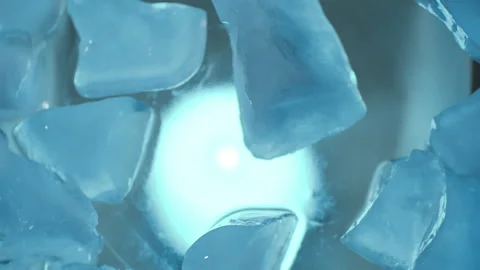 Movement of pieces of ice crystals in a circle with blue illumination. Stock Footage 262749876