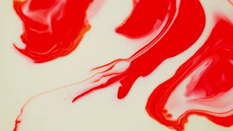 Movement of red spots of paint on a white background. Stock Footage 276873264